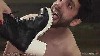 The muscled dominatrix dominates her slave boy with intensity
