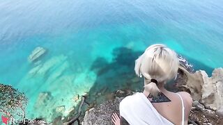 The cute girlfriend passionately sucks her ex-boyfriend's big dick on the ocean shore