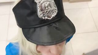 A sexy girl is dressed as a police officer, searching for a robber in an apartment