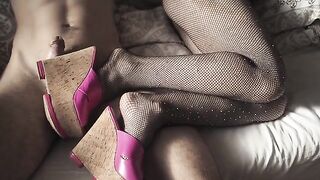 The sexy girl in high heels and stockings is ready for footjob
