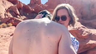 A woman has sex with her friend in front of her husband in the desert
