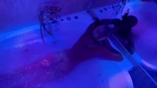 A blonde woman with sex toys in the bathroom, showcasing her wild side