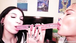Two lesbian beauties play with their nice pussy using a dildo