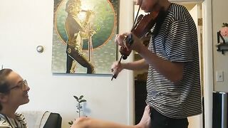 Girl tries to practice violin but is interrupted by her passionate boyfriend