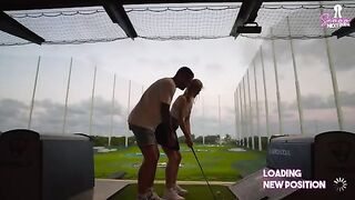 A hot blonde is having fun with her boyfriend on a golf date