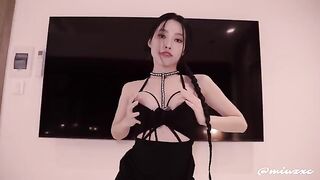 Young and sexy Asian girl in black dress, who knows how to please