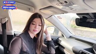A girl is having fun with a guy in the car, getting intimate