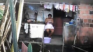 A black woman did not know that there was a hidden camera in the room