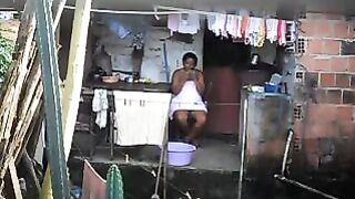 A black woman did not know that there was a hidden camera in the room