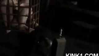The slave in the cage fulfills all orders of the master, showcasing total domination