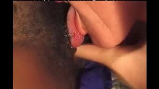 A young black girl is having fun with an older white man