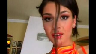 Sexual beauty in a leather chair achieves a solo orgasm