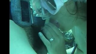 A man penetrates a hairy pussy of a woman right in the water