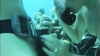 A man penetrates a hairy pussy of a woman right in the water