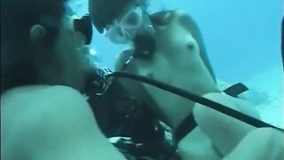A man penetrates a hairy pussy of a woman right in the water