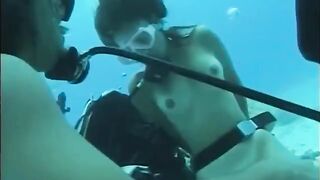A man penetrates a hairy pussy of a woman right in the water