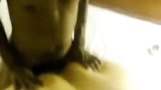 A fat woman laid on the man and took two cocks in her pussy