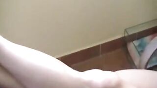 A naked girl with big natural tits was smoking and got burned