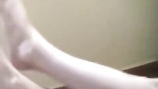 A naked girl with big natural tits was smoking and got burned