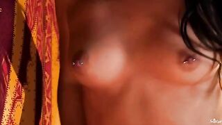 A girl with a clitoris piercing plays with her nipples