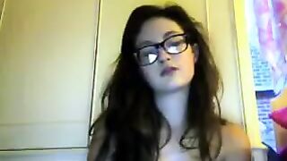 A cute girl in glasses stripping on the webcam live show
