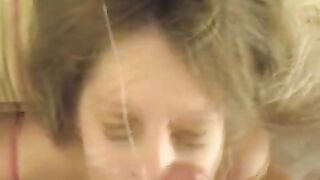 Blonde girl gets cumshot on her face after giving a blowjob