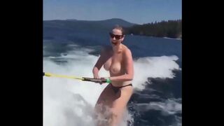 Topless girl skiing on water, her tits dripping wet and absolutely free