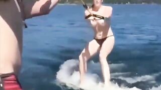 Topless girl skiing on water, her tits dripping wet and absolutely free