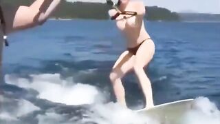 Topless girl skiing on water, her tits dripping wet and absolutely free