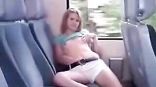 On the bus, she began to iron her pussy through her panties in the back seat