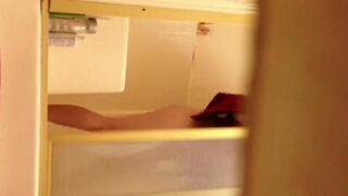 A girl takes shower and a hidden camera films it all