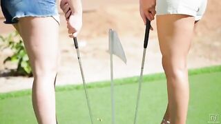 A beautiful woman is having fun with lesbian sex in golf