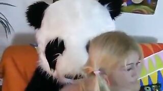 A cute girl fucks with a bear in the form of Panda