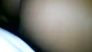 A beautiful black woman has sex with a young man, showcasing her tight crotch in action
