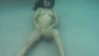 Sexual beauty has sex with her partner in the ocean, showcasing her huge boobs