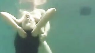 Sexual beauty has sex with her partner in the ocean, showcasing her huge boobs