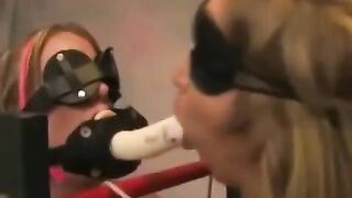 Two girls are having fun through the medium of bondage