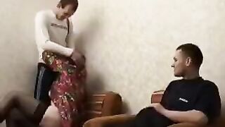 A mature woman has sex with her son's friend in this hot video