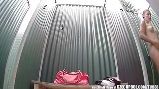 A girl washes her body in the shower, not knowing there’s a camera