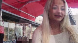 A sexy blonde with huge natural tits in a private scene