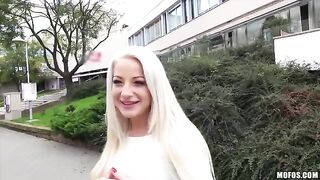 A sexy blonde with huge natural tits in a private scene