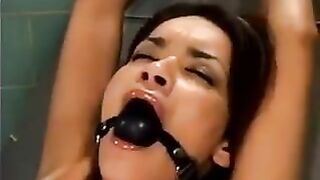 A bald man fucked a girl with a machine in her sweet pussy