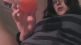 A girl stimulates her clit with a powerful vibrator in an intense solo session
