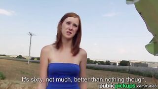 A red-haired girl was having fun with her boyfriend in the hay pile