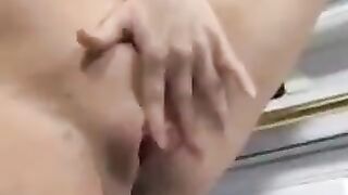 A man came to the kitchen and saw a pregnant woman, who was cooking