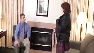 The fat woman in stockings and pantyhose satisfies her boss on the couch