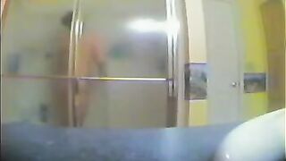 A girl has no idea there’s a camera in the shower