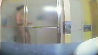 A girl has no idea there’s a camera in the shower