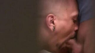 Two guys are jerking each other's cocks in a public WC