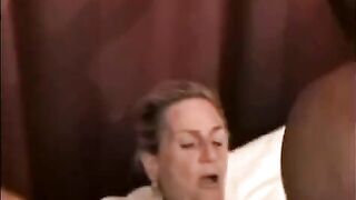 A mature woman is having sex with a black man’s huge dick